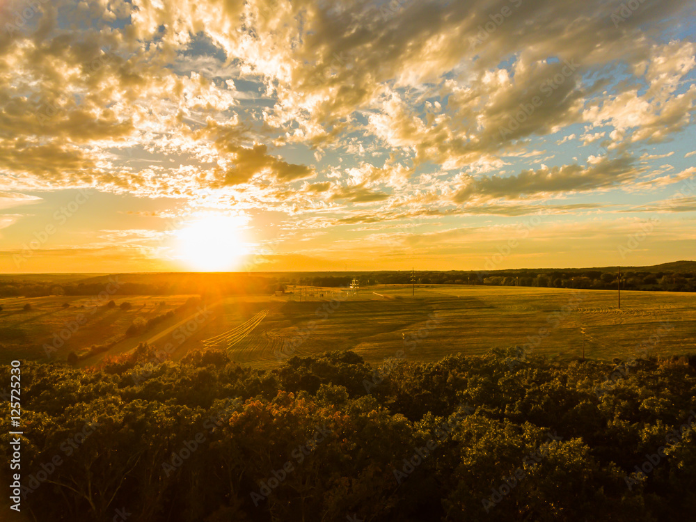 Vivid sunset over a Missouri hay field