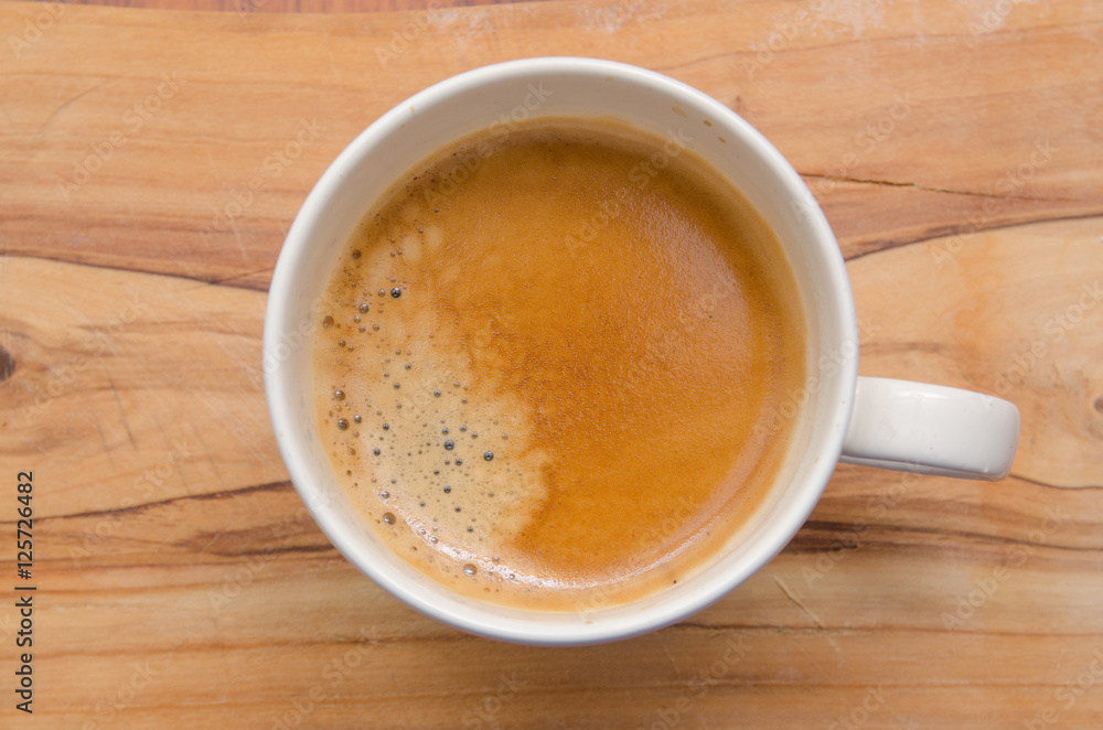 Italian hot coffee on wood table Italian hot coffee on wood table