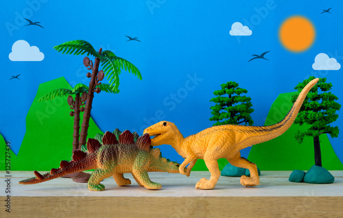 Dinosaur fight scene on wild models background © Noey smiley