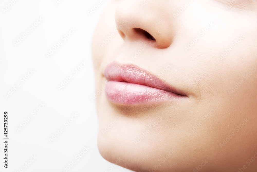 Obraz premium Plump sexy lips and perfect skin on a white background