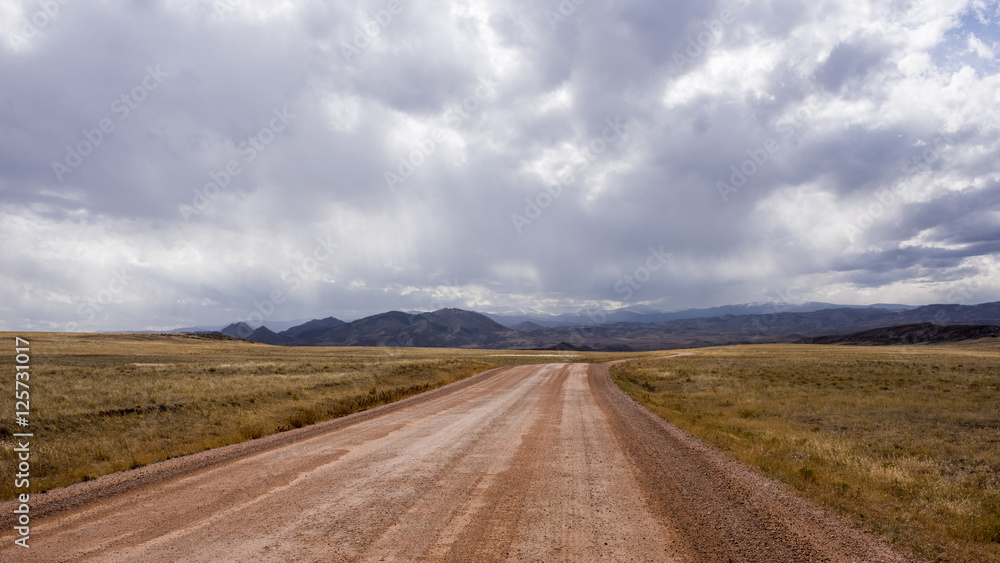 Road Through a Colorado Valley with Mountains in the Background