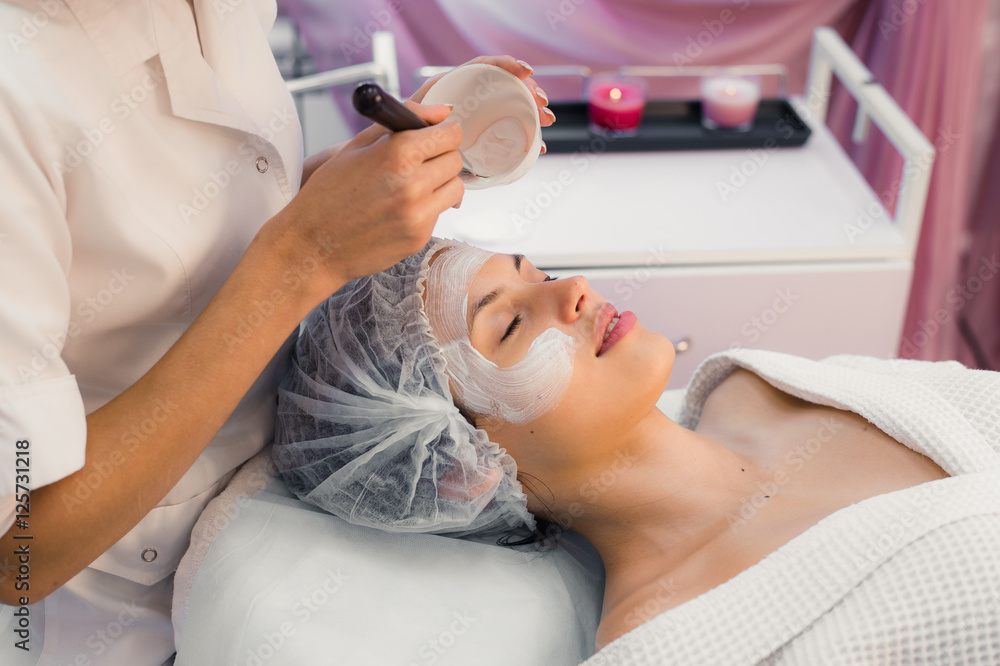 Young beautiful woman having spa procedure on her face Young beautiful woman having spa procedure on her face