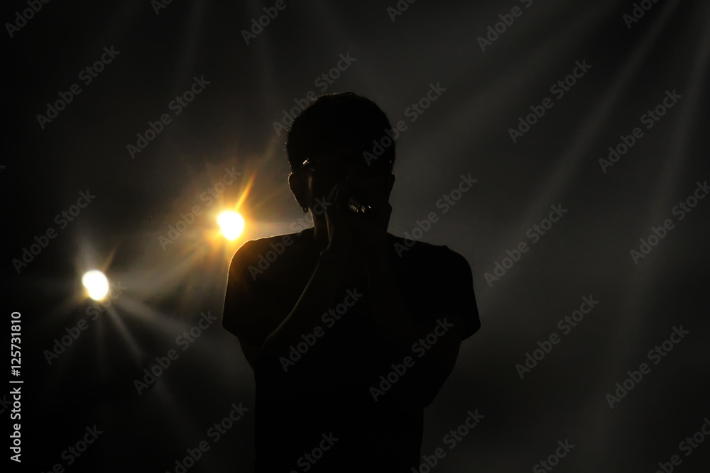 Silhouette of singer.