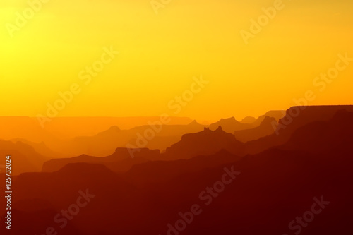 Panoramic View of Grand Canyon in yellow and red colors after sunset © Michael Urmann