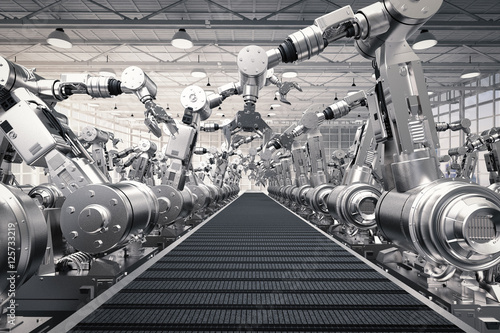 robotic arms with empty conveyor belt photo