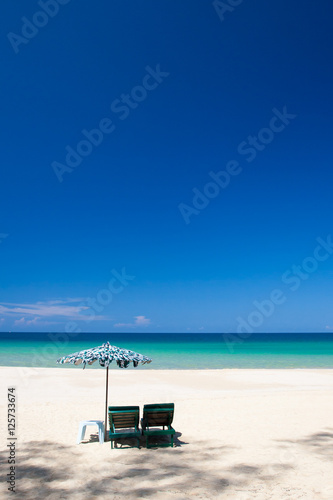 Beach chairs and parasol on Nai Thon beach. Phuket, Thailand. © Tee11