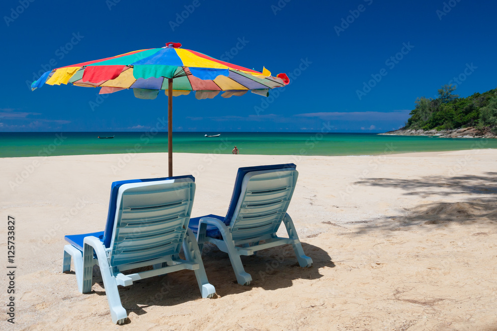 Beach chairs and parasol on Nai Thon beach. Phuket, Thailand.