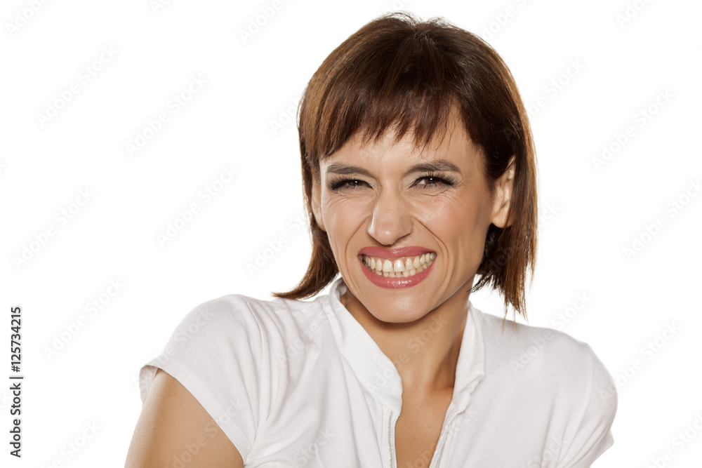 a grinning middle-aged women with separate teeth a grinning middle-aged women with separate teeth