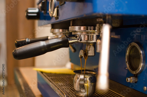 Young man making coffee