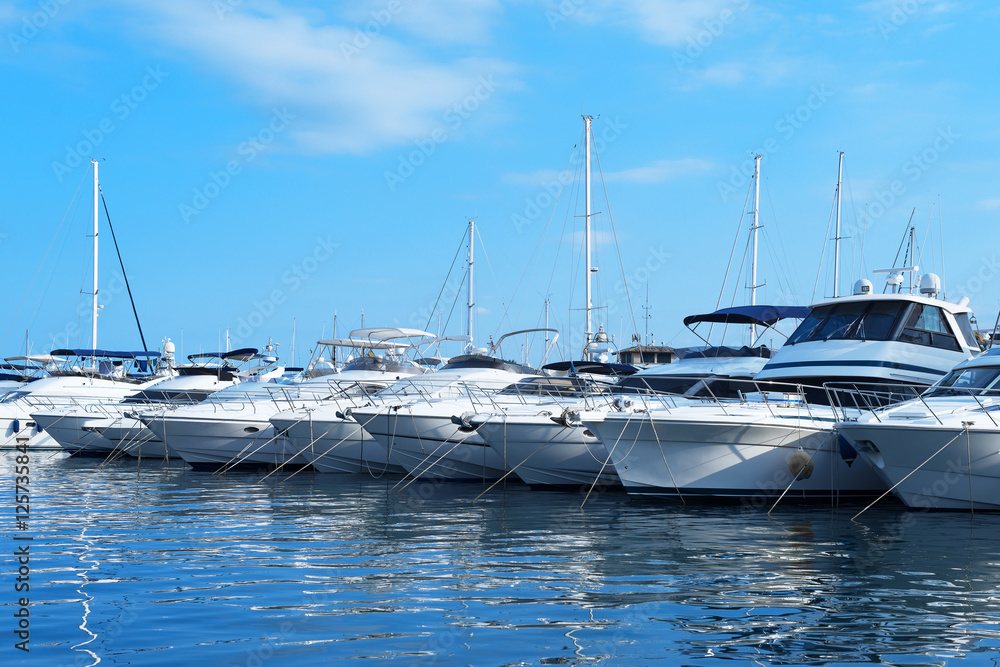 Many luxury yachts and boats in the harbor. Many luxury yachts and boats in the harbor.