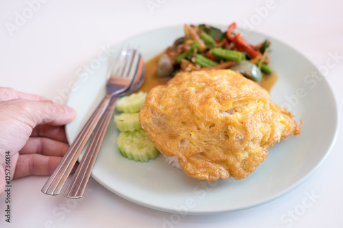 Omelette and Spicy fried  thai food.