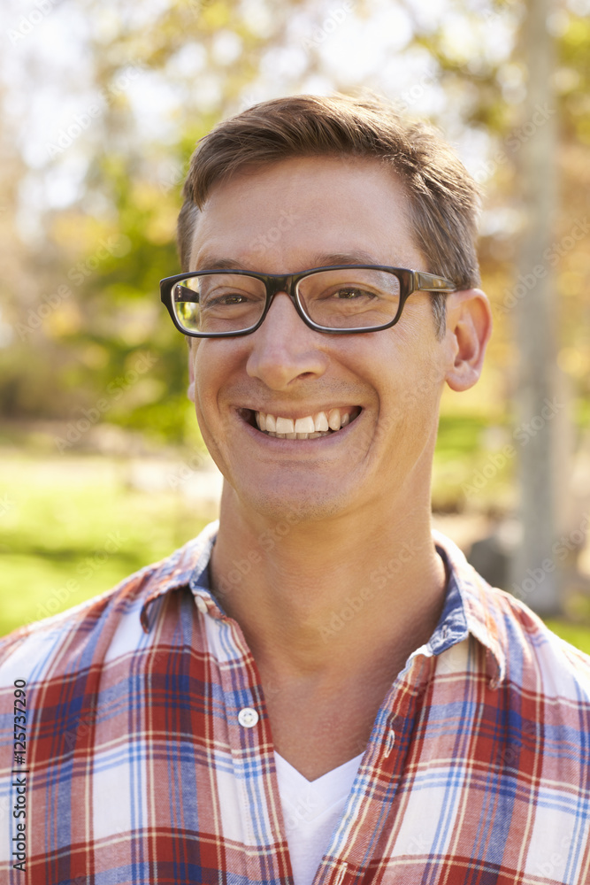 Middle aged white man in glasses smiling to camera, vertical Middle aged white man in glasses smiling to camera, vertical