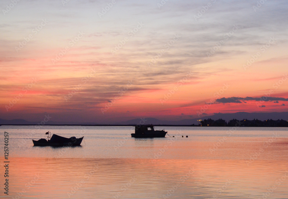 Fishing boat on the sea at sunset. Fishing boat on the sea at sunset.