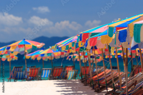 Beach chairs and parasol on Koh Khai island. Phuket, Thailand.