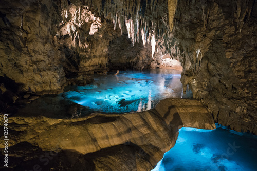 Okinawa, Japan - October 21, 2016: Gyokusendo Stalactite cave in Okinawa island, Japan. The cave was formed approximately 300,000 years ago and has 5000 meter long photo