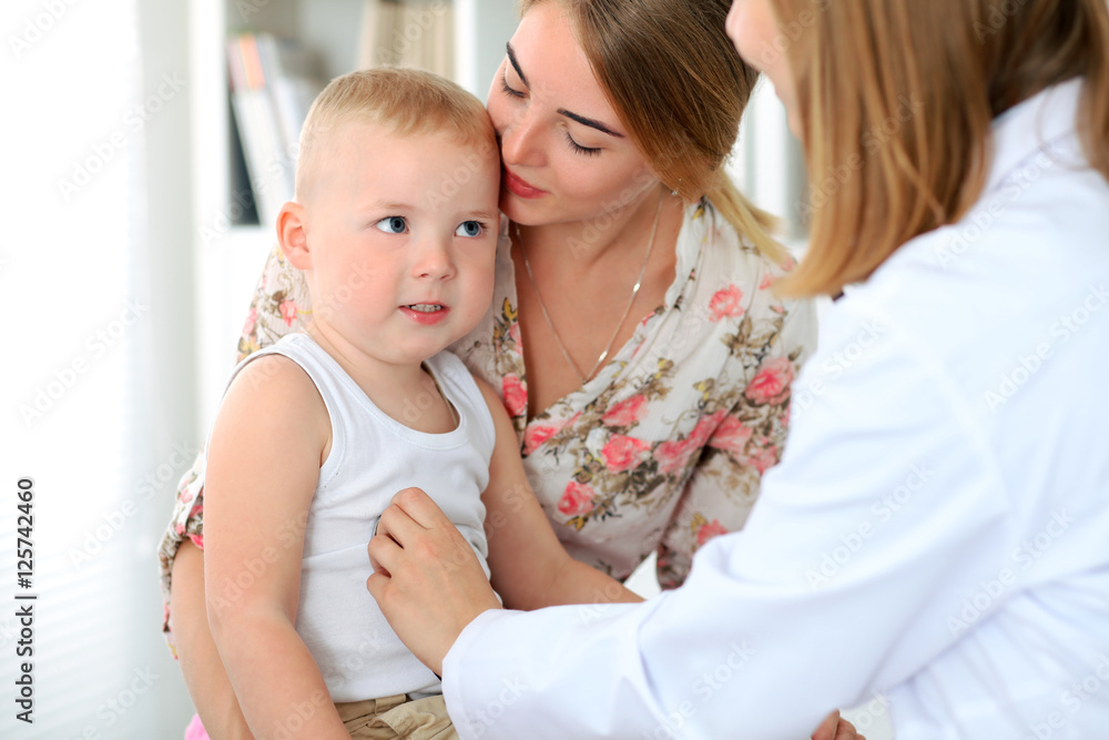 Doctor examining a child patient by stethoscope Doctor examining a child patient by stethoscope