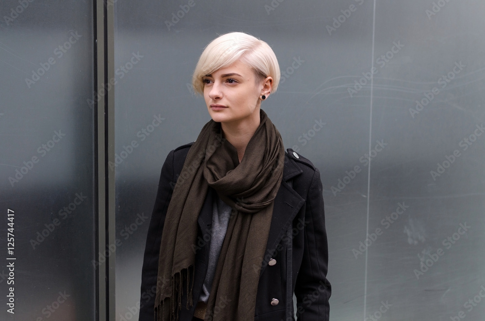 Young blonde girl walking on the city Young blonde girl walking on the city