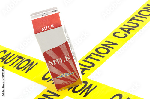 Dietary warning or lactose intolerance allergy warning (generic carton of milk on top of yellow caution tape)
