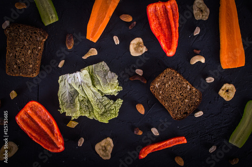 Separate breakfast ingredients. Scattered. On a wooden background.