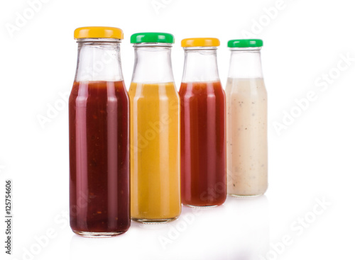 Bottled sauces. On white, isolated background.