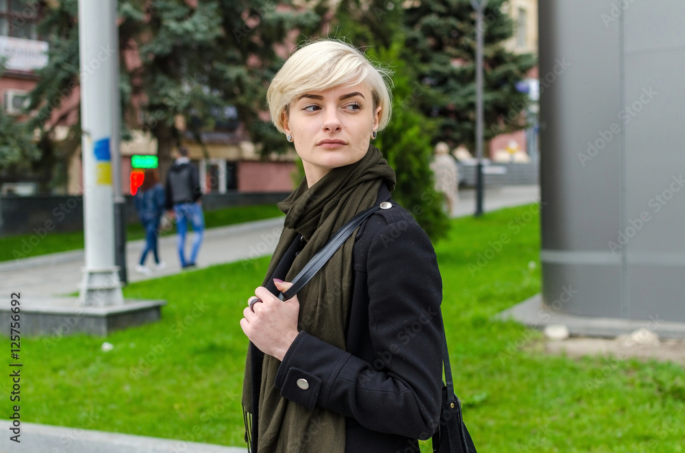 Young blonde girl walking on the city Young blonde girl walking on the city