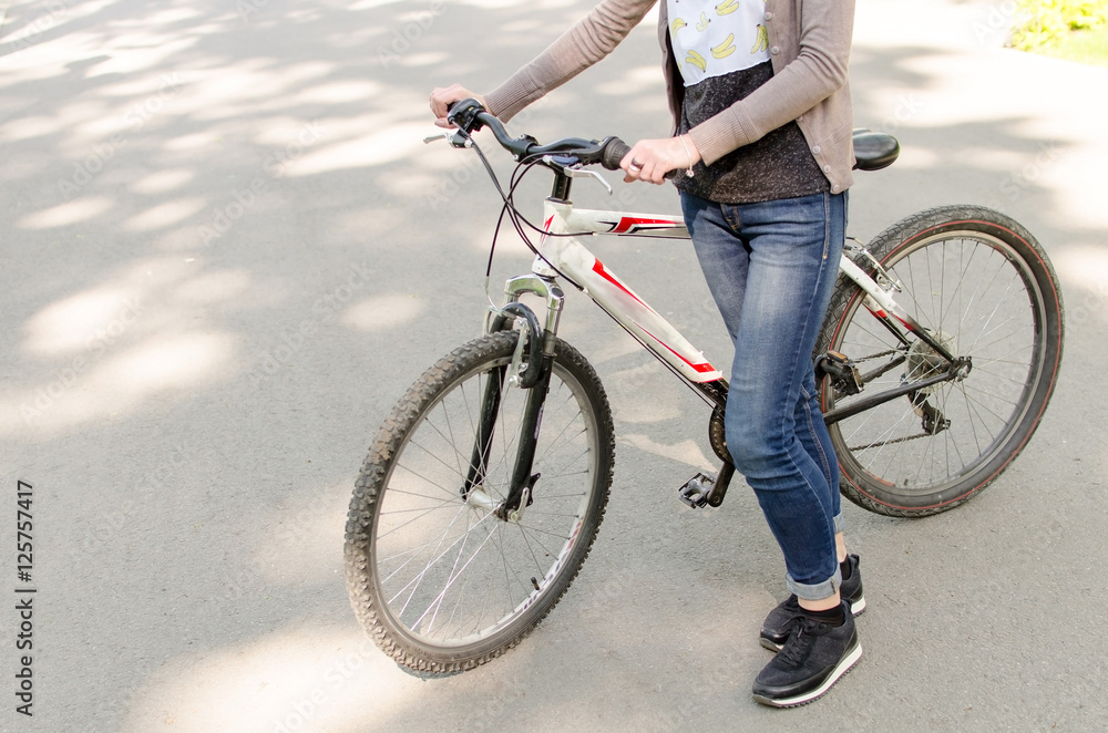 Young girl with a bicycle Young girl with a bicycle