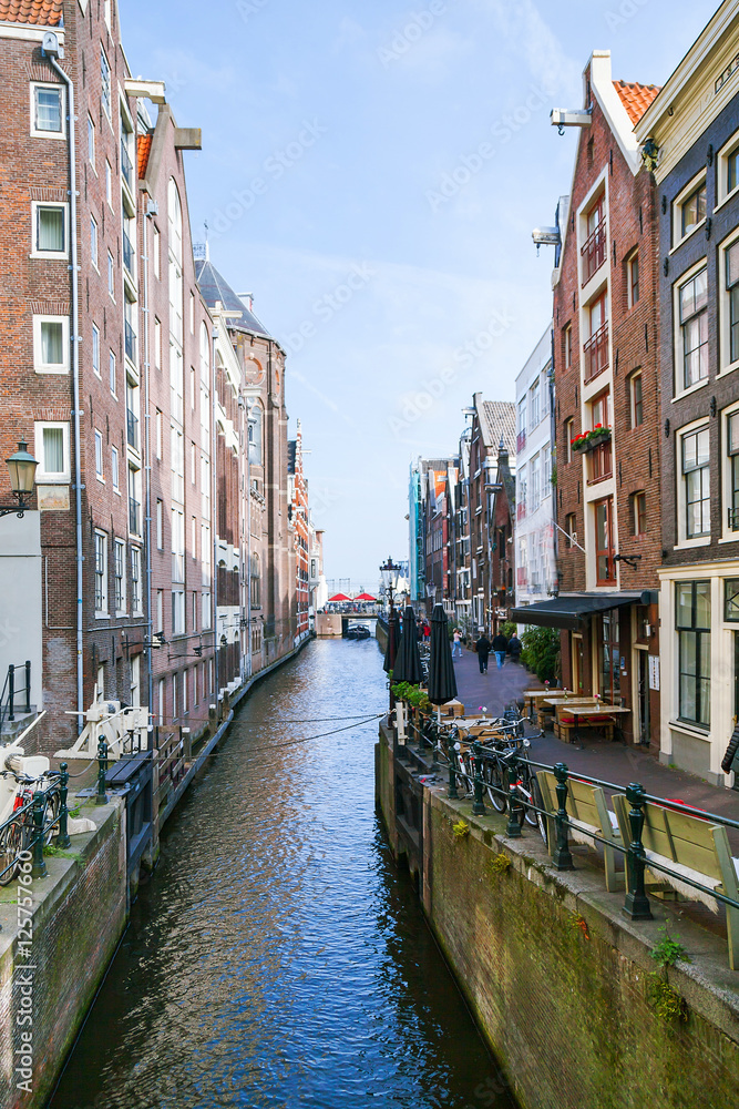 Traditional houses of Amsterdam with canals and bridges