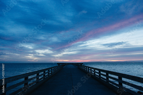 Sunrise over pier photo