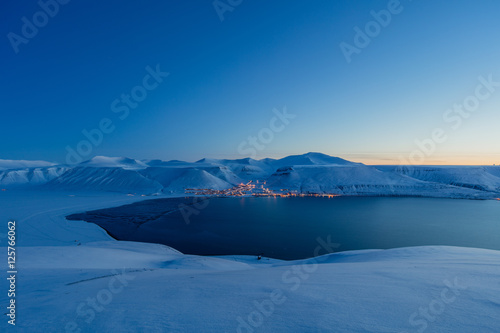 Worlds northernmost town - Longyearbyen in blue light photo