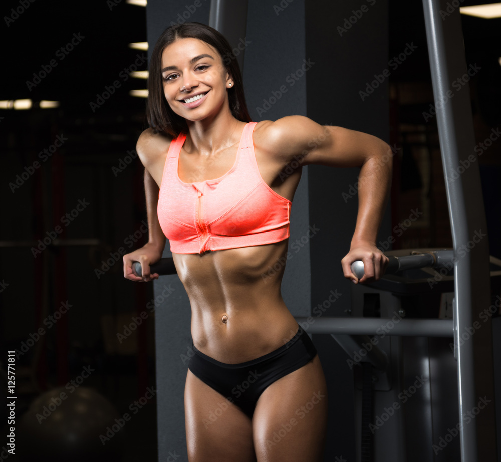 Fitness Girl Posing in the Gym Stock Photo  Image of people dark 79945672
