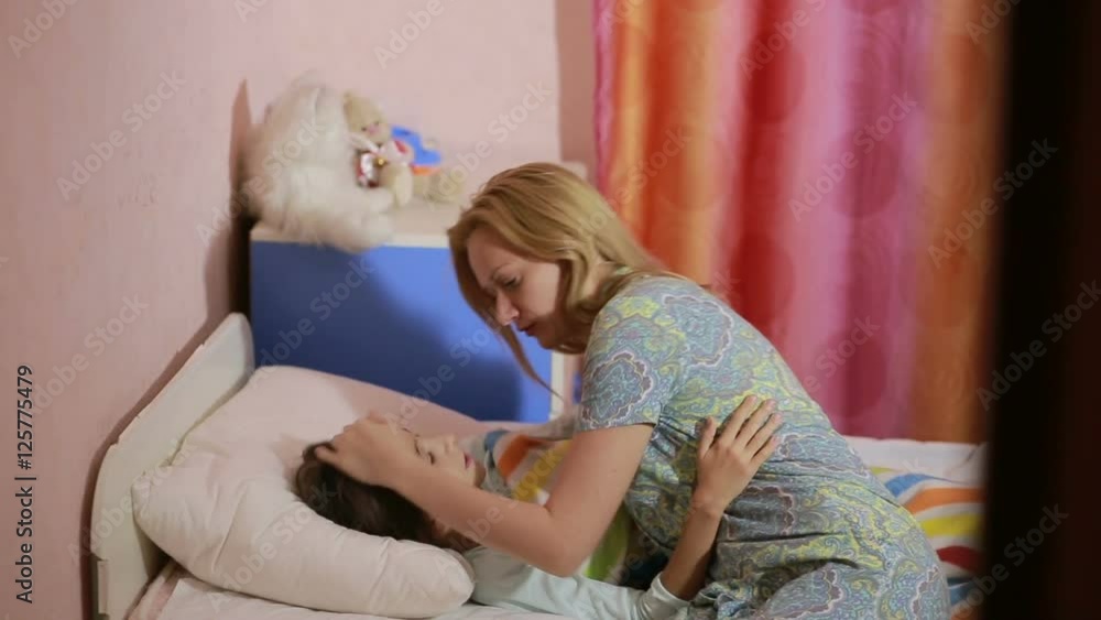 mother puts daughter to bed. baby sleep Stock Video