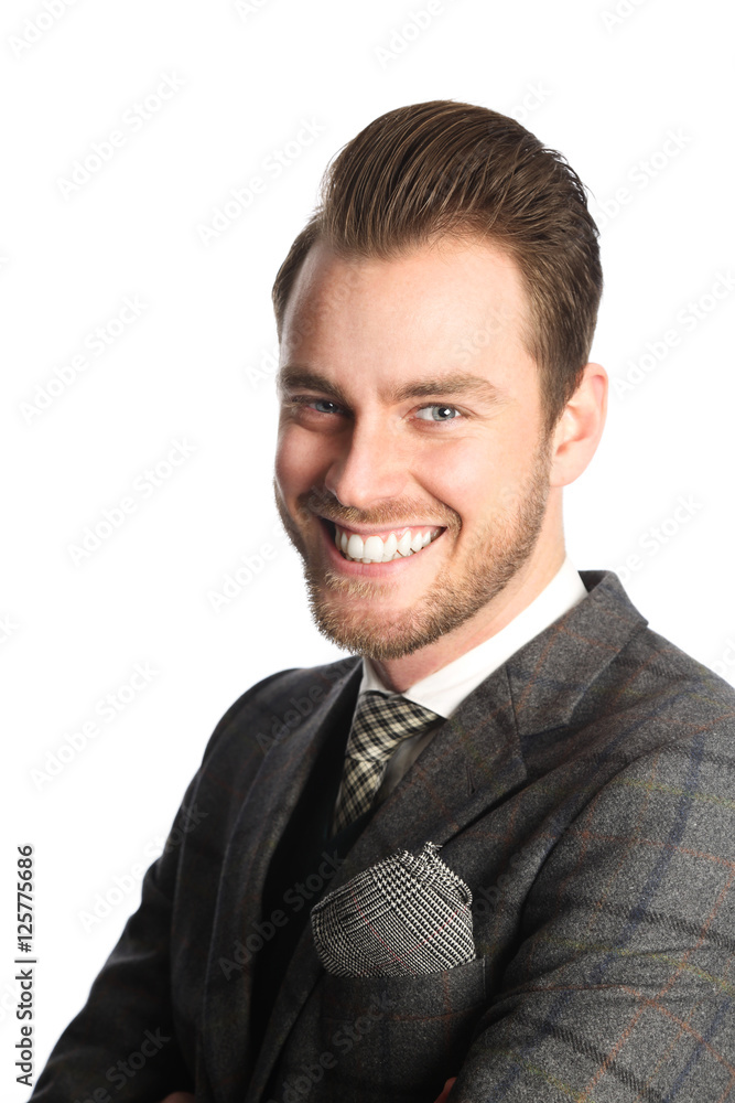 Portrait of an attractive businessman in a grey suit with tie, smiling feeling happy. White background. Portrait of an attractive businessman in a grey suit with tie, smiling feeling happy. White background.