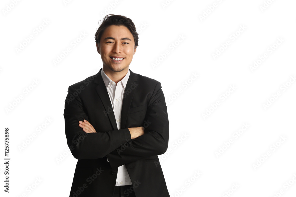 An attractive businessman wearing a black blazer with a white shirt, standing against a white background looking at camera. Smile on his face. An attractive businessman wearing a black blazer with a white shirt, standing against a white background looking at camera. Smile on his face.