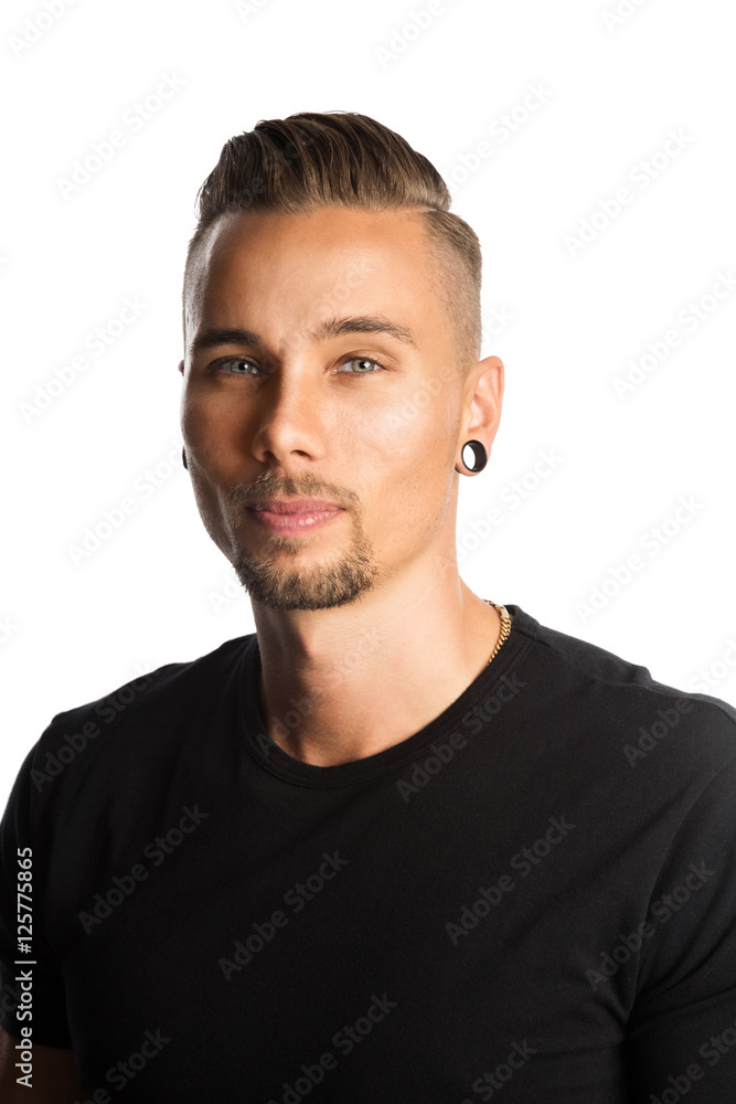 A fit attractive man wearing a black t-shirt, with arms crossed looking at camera. White background. A fit attractive man wearing a black t-shirt, with arms crossed looking at camera. White background.