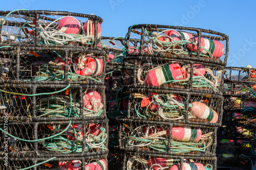 Canvas Print Crab Pots stacked beside the dock waiting for the season to open