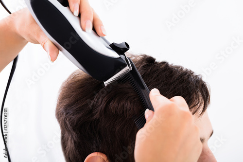 Hairdresser Cutting Person's Hair