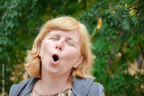 Mature caucasian woman acting an ape