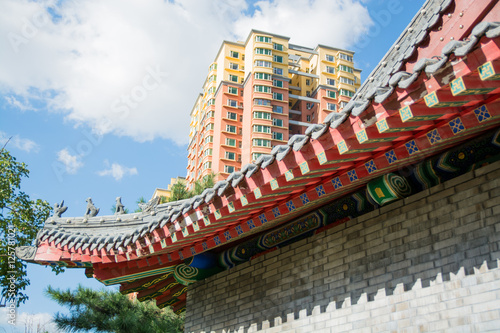 Cornice of traditional chinese roof and contemporary building.