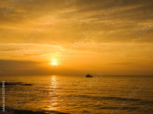 Scenic view of beautiful sunset above the sea and silhouette a b
