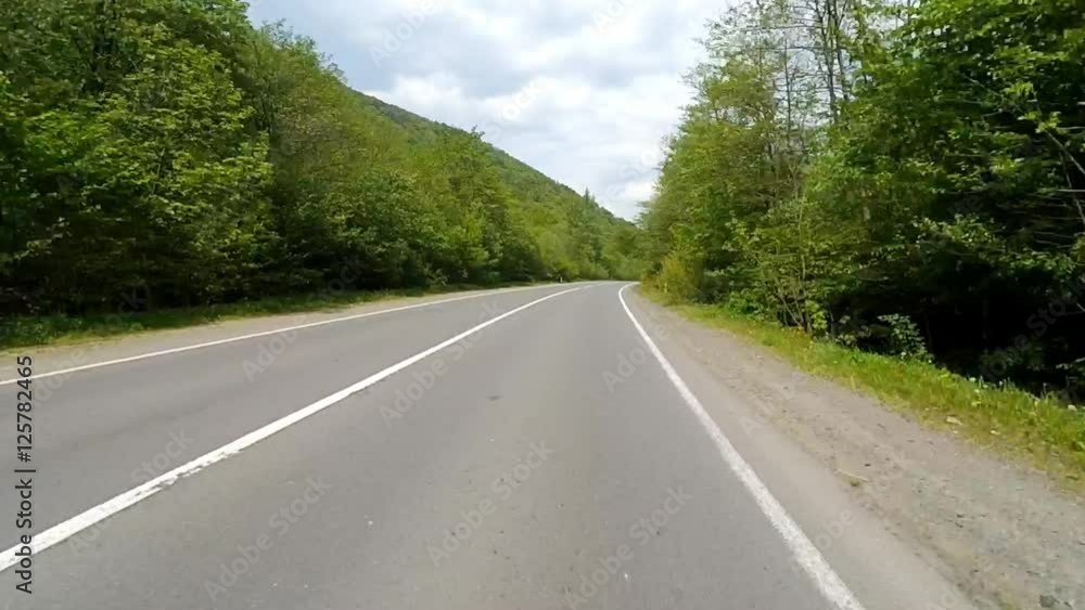 Driving on the highway in the mountains. Point of view camera filming. Driving on the highway in the mountains. Point of view camera filming.