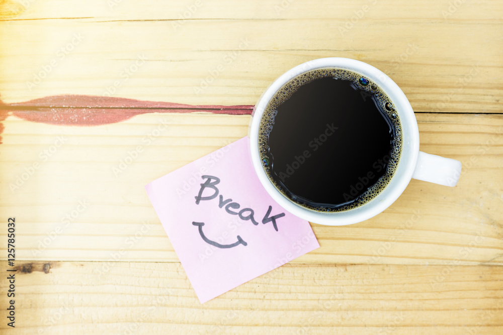 break in pink pos it and laptop keyboard, on red wood background break in pink pos it and laptop keyboard, on red wood background