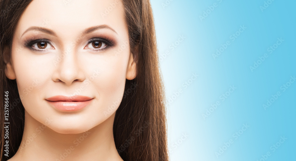 Portrait of a young woman on a light blue background Portrait of a young woman on a light blue background