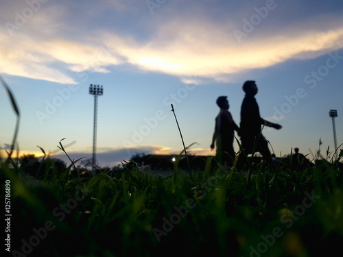 Blurry Silhouette of starting blocks in field.