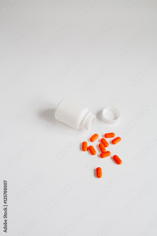 tablets in plastic container top view tablets in plastic container top view