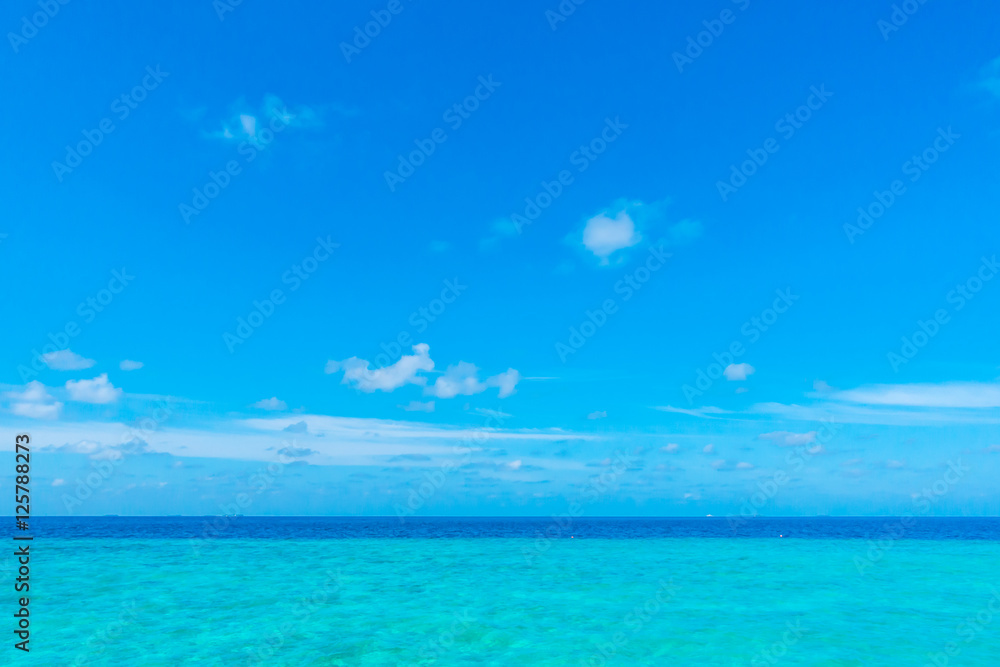 White clouds with blue sky over calm sea  in tropical Maldives i