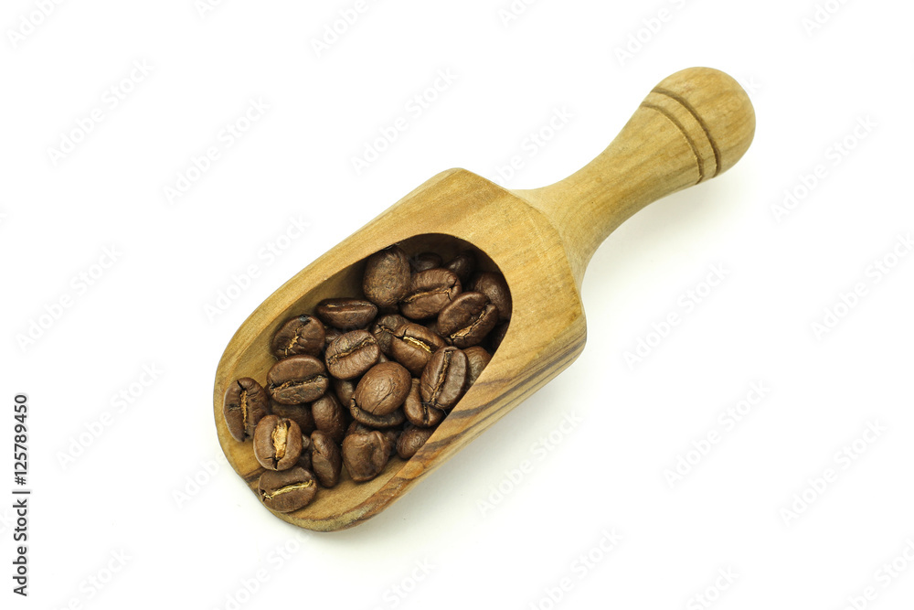 Coffee beans in wooden spoon Coffee beans in wooden spoon