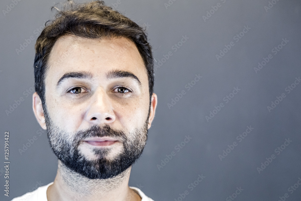 Fototapeta premium Young Turkish man with short beard studio portrait