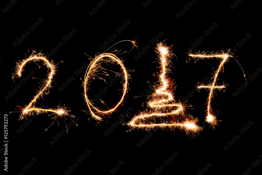 HAPPY NEW YEAR 2017 written with fireworks as a background HAPPY NEW YEAR 2017 written with fireworks as a background