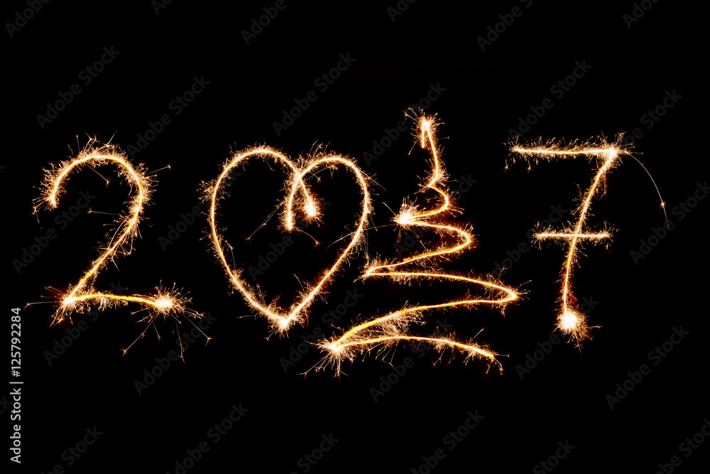 HAPPY NEW YEAR 2017 written with fireworks as a background HAPPY NEW YEAR 2017 written with fireworks as a background