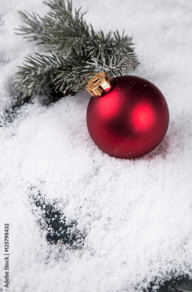 Red balls decorations on snow, Christmas celebration concept, Holiday object with free space for text 